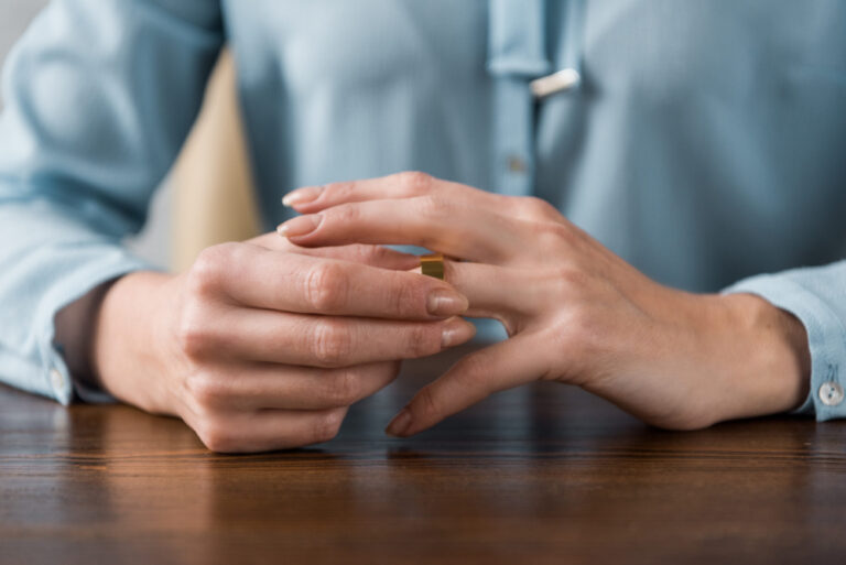 holding wedding ring